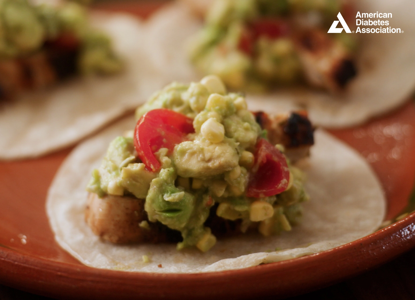 Lime – Rubbed Chicken Avocado Tacos with Corn Guacamole